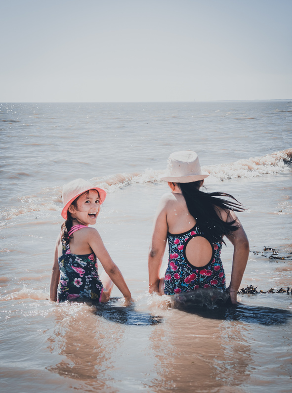 Kids Swimming on the Beach